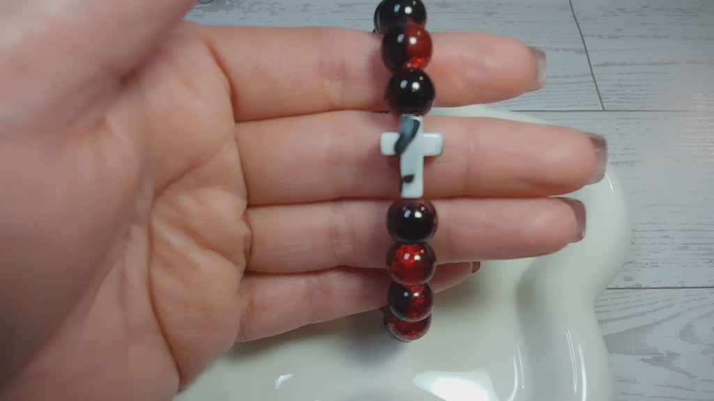 Red and Black Crackle Beaded Stretch Bracelet with Black and White Swirl Cross
