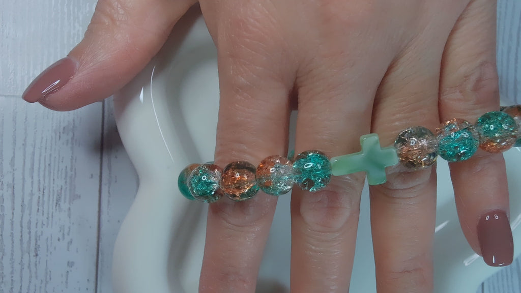 Orange and Green Beaded Stretch Bracelet with Green Cross