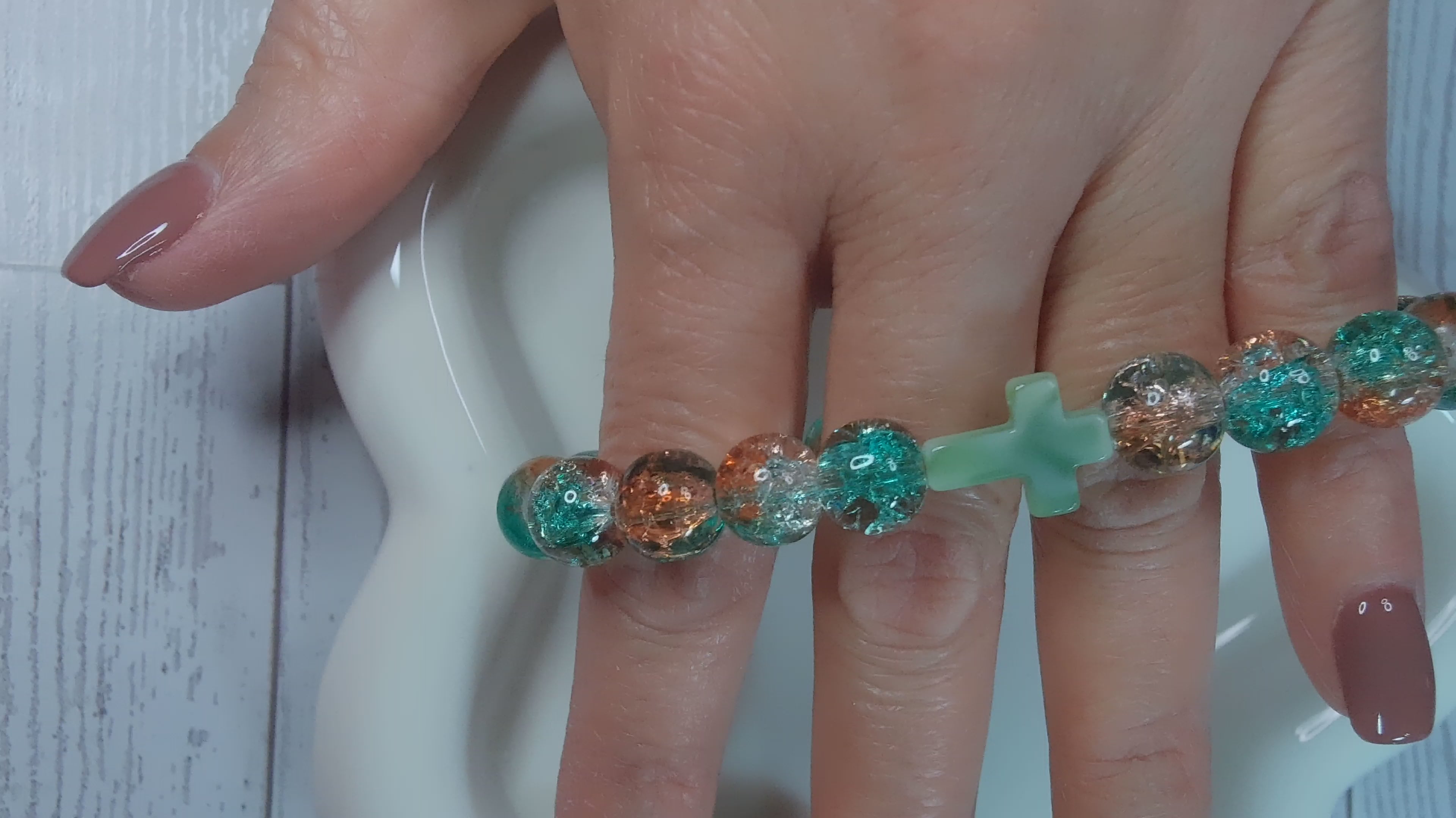 Orange and Green Beaded Stretch Bracelet with Green Cross