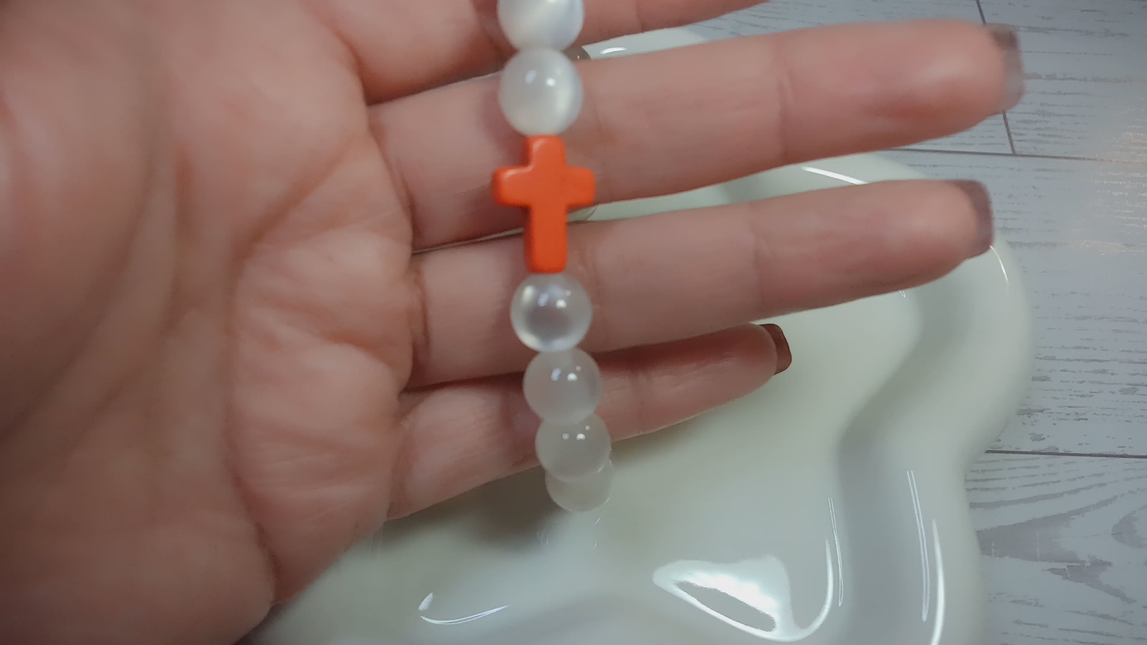 White Cat Eye Beaded Stretch Bracelet with Orange Cross