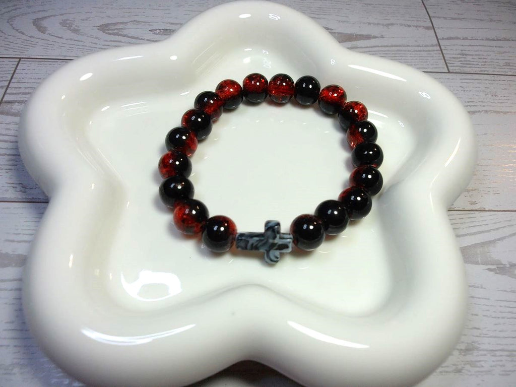 Red and Black Crackle Beaded Stretch Bracelet with Black and White Swirl Cross